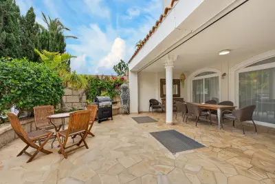 Outdoor lounge and dining area with private BBQ