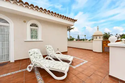 Upper-floor terrace with sun loungers