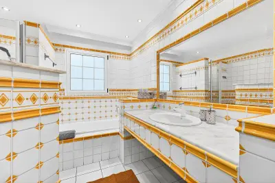 Spacious bathroom with bathtub