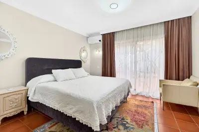 Stylish bedroom with private terrace access