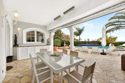 Ocean-view terrace with dining area and pool